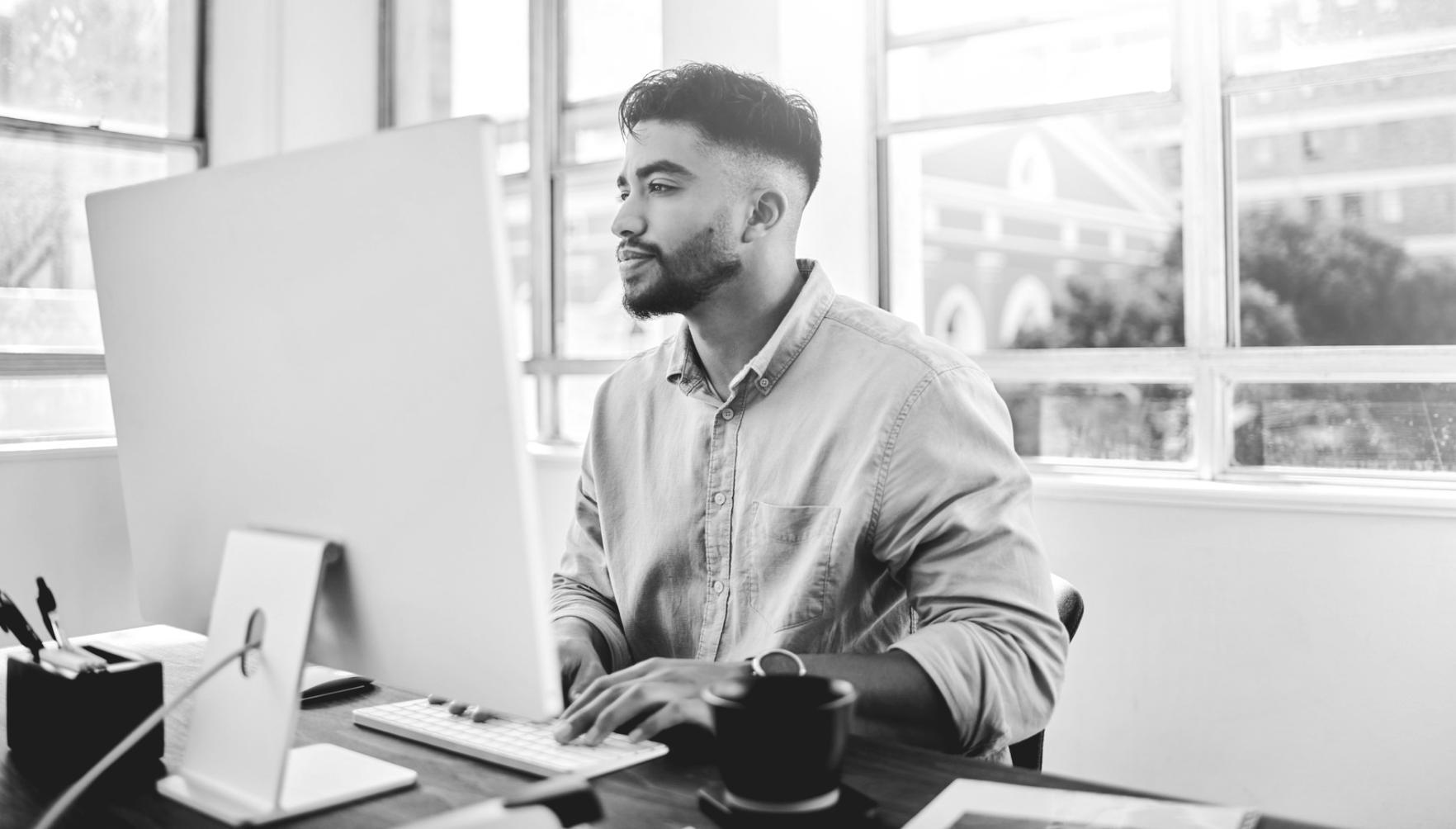 Team reviewing conversion test results on multiple screens